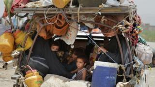 Pakistani civilians, fleeing from a military operation in North Waziristan tribal agency, arrive at the Bannu Frontier Region registration centre for internally displaced people in Saidgai on June 22, 2014.