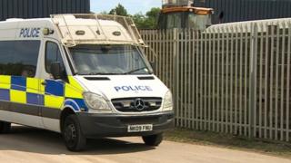 Police van at the waste management site