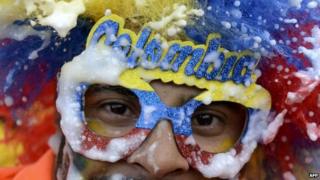 A fan of the Colombian national team celebrates after their victory over Uruguay