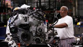 Man working on car engine
