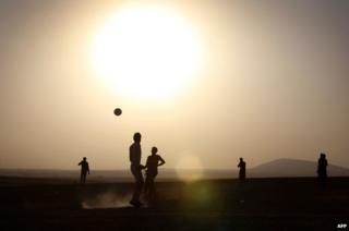 Displaced Iraqis playing football near Erbil