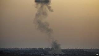 Smoke rises following an Israeli strike on Gaza, seen from the Israel-Gaza border, 12 July 2014