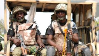 Nigerian soldiers ready for a patrol in the north of Borno state on 5 June 2013 in Maiduguri