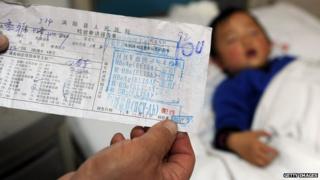 A photo of a form in Chinese with the positive results of a child's hepatitis C test
