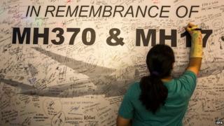 Signing a memorial wall for Malaysia Airlines MH370 and MH17 in Kuala Lumpur