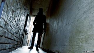 Picture of a person in an alleyway