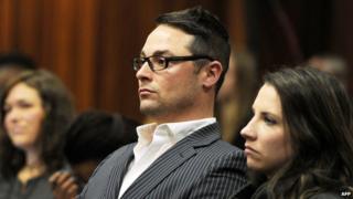 Carl Pistorius (2nd R) and Aimee Pistorius (R), the siblings of South African paralympian Oscar Pistorius, sit at the High Court in Pretoria during Oscar Pistorius" trial on July 2, 2014
