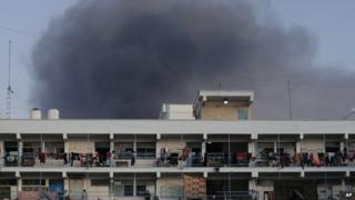Smoke rises from rockets over a UN-run refugee camp in Jabaliya in northern Gaza