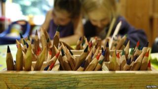 Colour pencils pictured as children draw