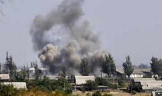 Smoke from shelling rises over Novoazovsk, eastern Ukraine, 27 August