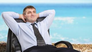 Man in suit on the beach