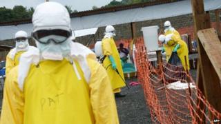 Health staff, wearing Personal Protective Equipment (PPE), work inside the high-risk area at Elwa hospital in Monrovia (7 September 2014)