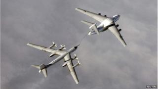 Russian Tupolev Tu-95 strategic bomber refuelling over an unknown location during a military exercise