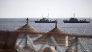 Egyptian navy vessels patrol off the coast of the Red Sea resort city of Sharm el-Sheikh on 17 February 2011.