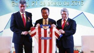 Atletico Madrid CEO Miguel Angel Gil, Wanda Group Chairman Wang Jianlin and Atletico Madrid President Enrique Cerezo