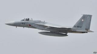 A Japan Air Self-Defense Forces F-15J/DJ takes off during an air review ceremony at the Japan Air Self-Defence Force's Hyakuri air base in Omitama, Ibaraki prefecture on 26 October 2014
