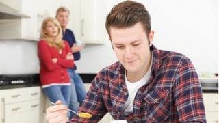 Young man with parents
