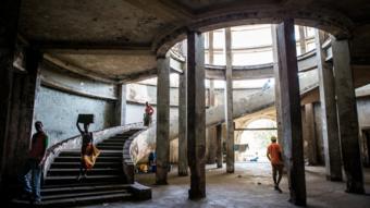 People in the staircase of The Grande Hotel in Mozambique's coastal city of Beira