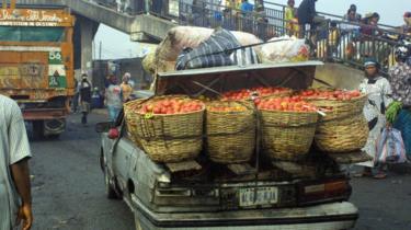 A vehicle overloaded with perishable foods heads to downtown Lagos from the Mile 12 market, 09 January 2006.