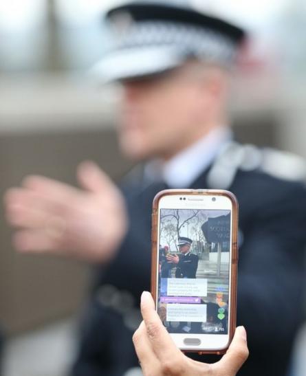 Mark Rowley, Assistant Commissioner for Specialist Operations in the Metropolitan Police, is filmed on a smartphone outside Scotland Yard in London