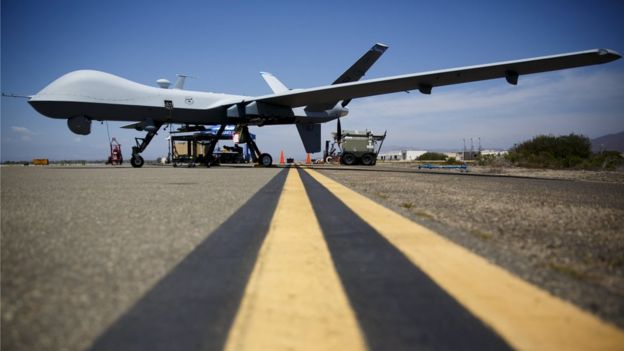 A General Atomics MQ-9 Reaper stands on the runway in California