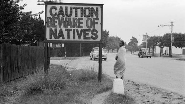 1956: A sign common in Johannesburg, South Africa, reading 'Caution Beware Of Natives'