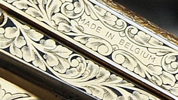 Close up of Gaddafi's gun - the words 'Made in Belgium' are visible