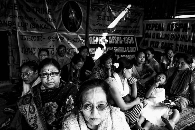 Meira Paibi's local female activists sit in a small shed built to house the supporters of Irom Sharmila, and Sharmila herself when she is released yearly. They sat to symbolically fast for four hours, November 4, 2013.