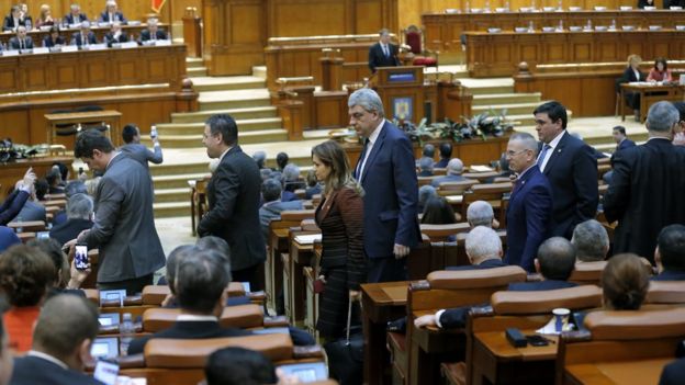 Lawmakers of the ruling coalition leave the hall as sign of protest against Romanian President Klaus Iohannis, who is addressing both parliament chambers (background, at the tribune) at the parliament headquarters in Bucharest, Romania, 7 February 2017