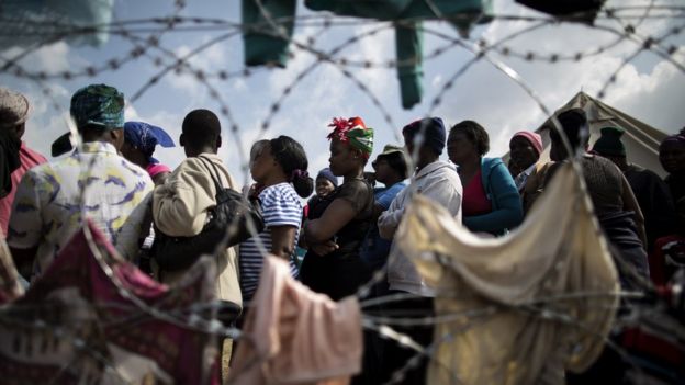Displaced people who fled the anti-immigrant violence are seen in a camp on April 19, 2015 in the village of Primrose, 15 kms east of Johannesburg