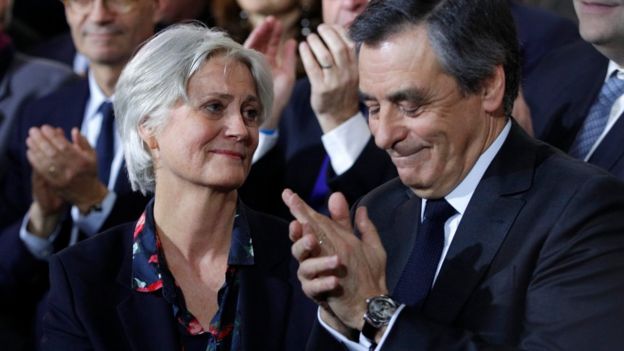 Conservative French presidential candidate Francois Fillon applauds alongside his wife Penelope