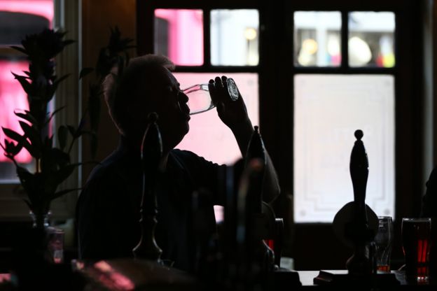 Man drinking in a pub