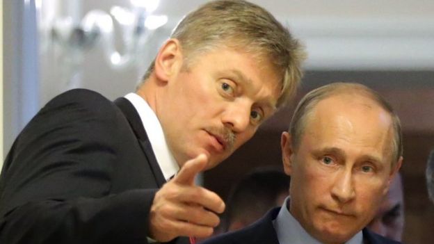 Dmitry Peskov with Vladimir Putin (R) - file pic