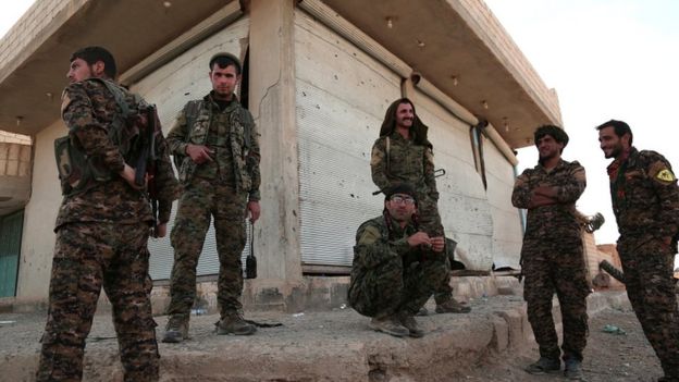 Syrian Democratic Forces (SDF) fighters gather in the town of Hisha after they took control of the area from Islamic State militants, in the northern Raqqa countryside, Syria November 14, 2016