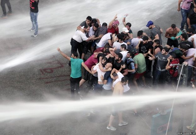 Lebanese activists sprayed by water cannon in Beirut, Lebanon