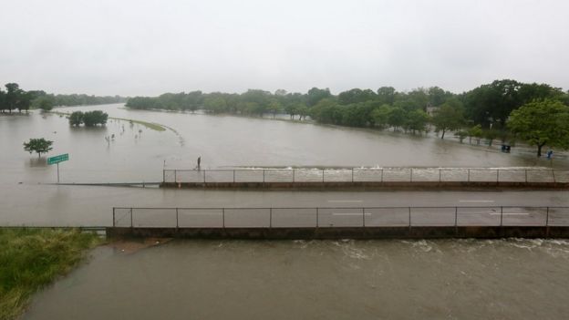 Brays Bayou floods after heavy rains hit the Houston region, Monday, April 18, 2016