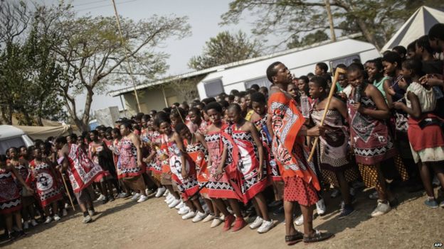 Swazi girls dance as they walk to the royal palace ahead of the traditional reed dance - 28 August 2015