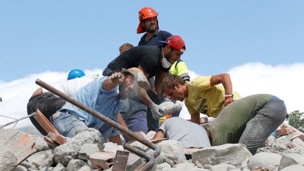 Rescuers work following an earthquake in Amatrice, central Italy