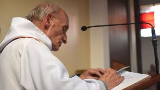 Father Jacques Hamel seen reading in an undated image
