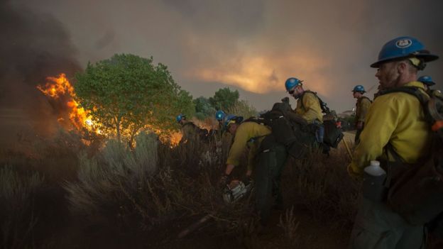 Firefighters of the Texas Canyon Hotshot crew fight the Sand Fire on July 23 2016 near Santa Clarita, California.