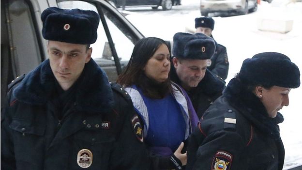 Gyulchehra Bobokulova (C) escorted by police arrives to the Presnensky district court in Moscow, Russia, 02 March 2016