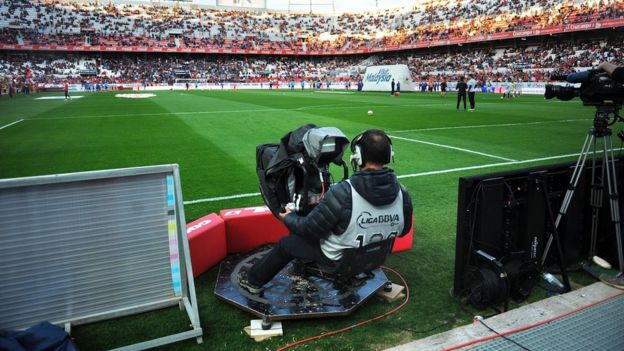 A camerman at a La Liga game between Sevilla and Atletico Madrid