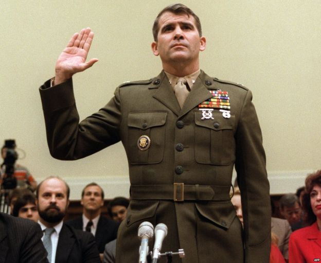 Lt-Col Oliver North, former aide to National Security Adviser John Poindexter, is sworn in 9 December 1986 before a US Congressional committee hearing in Washington about arms sales to Iran and diversion of profits to Nicaraguan Contra rebels
