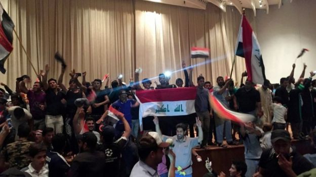 Followers of Moqtada al-Sadr are seen in the parliament building 30 April