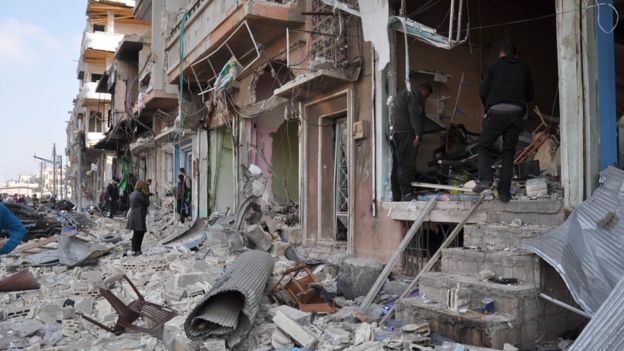 Damaged buildings following a twin suicide bombing in Syria