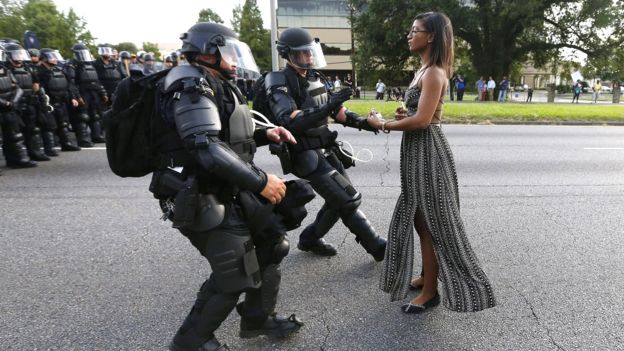 Iesha Evans stand sup to police lines