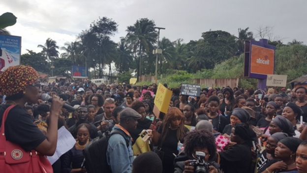 Crowd gathered at the spot where Hannah Bockarie's body was found in Sierra Leone's capital, Freetown.