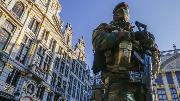 A Belgian soldier patrols the Grand Place in Brussels