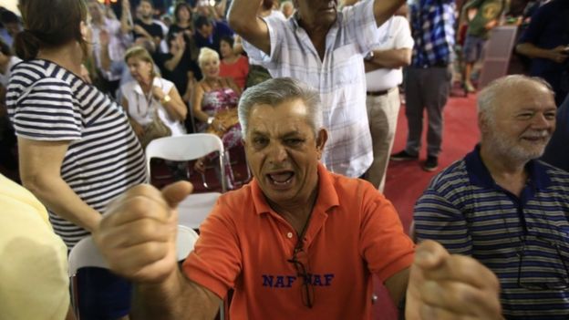 Syriza supporters celebrate at the party's electoral HQ in Athens, 20 Sept