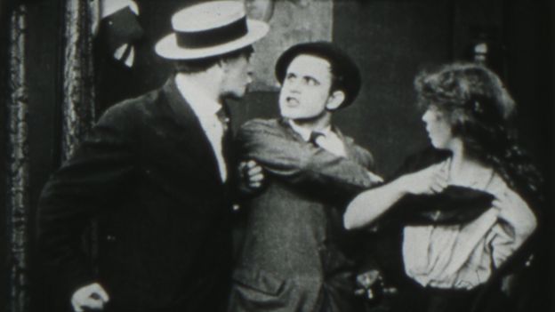 Still from The Musketeers of Pig Alley (1912)